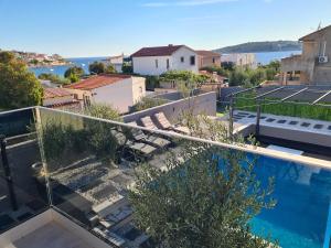 a view of a balcony with a swimming pool at Villa M&M in Sevid