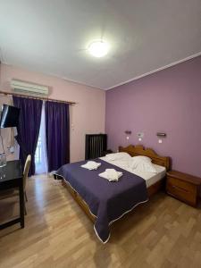 Postel nebo postele na pokoji v ubytování Hotel Korinthos