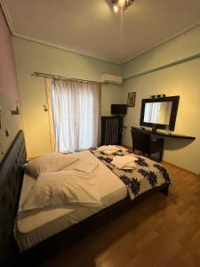 Postel nebo postele na pokoji v ubytování Hotel Korinthos