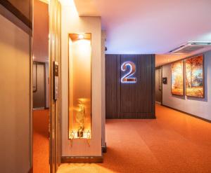 a hallway with a number on the wall at The One Smart Living in Bangkok
