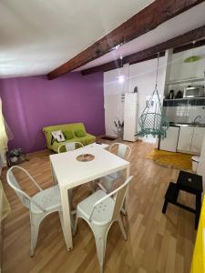 a living room with a white table and chairs at Alezard in Toulon