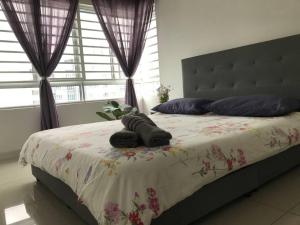 Кровать или кровати в номере Villa Selatan Southville City