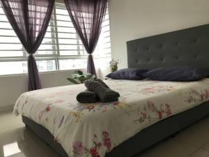 a bedroom with a bed with two pillows on it at Villa Selatan Southville City in Kampong Tangkas +31 photos