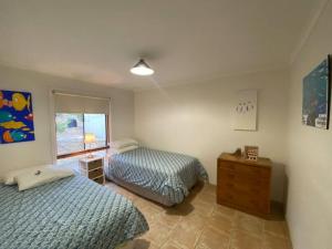 a bedroom with two beds and a window at Kepals on the Coast - Kangaroo Island in Penneshaw