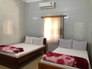 En eller flere senge i et værelse på Việt Long 2 hotel