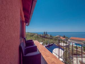 a balcony with a view of the ocean at Harmonia Bungalows & Pool in Sveti Stefan