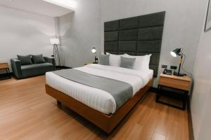 Postel nebo postele na pokoji v ubytování El Sancho Hotel