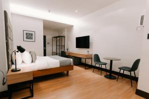 TV a/nebo společenská místnost v ubytování El Sancho Hotel