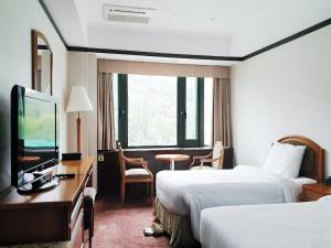 Postel nebo postele na pokoji v ubytování The K Hotel Gyeongju