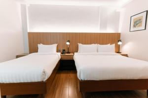 Postel nebo postele na pokoji v ubytování El Sancho Hotel