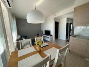 a kitchen and dining room with a table and chairs at Meritähti 205 in Kalajoki