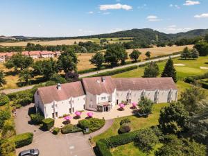 an aerial view of a house with a yard at Hotel ibis Autun in Autun