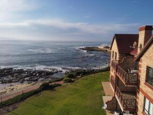 an aerial view of the ocean from a building at Annie Benn 5 in Mossel Bay +12 photos