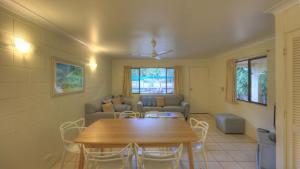 a living room with a table and a couch at Arcadia Palms 2 in Arcadia