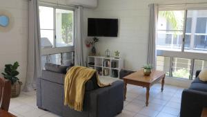 a living room with a couch and a table at Arcadia Beach Unit 4 in Arcadia