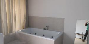 a white bath tub sitting next to a white sink at B&B La Gaetana in Gaeta