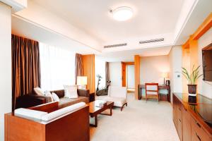 Postel nebo postele na pokoji v ubytování Kunshan Yu Yuan Garden Hotel