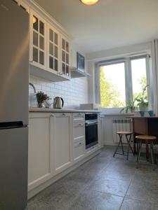 Köök või kööginurk majutusasutuses Comfortable and cosy apartment 3 beds-city center