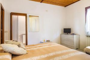 A bed or beds in a room at Perla marina