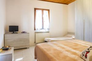 A bed or beds in a room at Perla marina