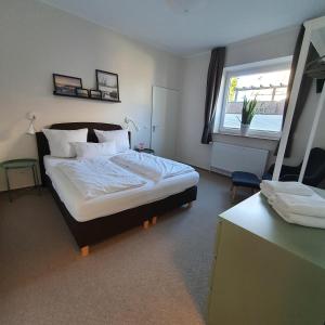 Postel nebo postele na pokoji v ubytování Gästehaus bed & kitchen