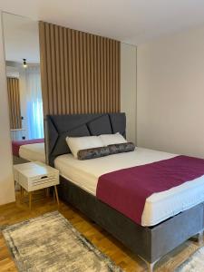 En eller flere senge i et værelse på New Concept including garage