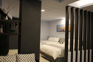 Posteľ alebo postele v izbe v ubytovaní Qian Qian Riverside B&B