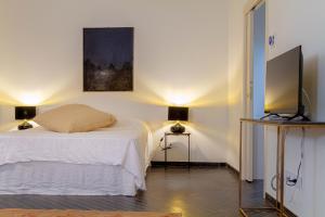 Postel nebo postele na pokoji v ubytování Palazzo Glori 6