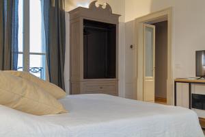 Postel nebo postele na pokoji v ubytování Palazzo Glori 6