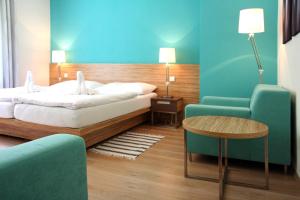 Posteľ alebo postele v izbe v ubytovaní Hotel Vyhlídka