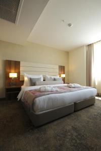 a large bedroom with a large bed in a room at Tuyap Palas in Istanbul