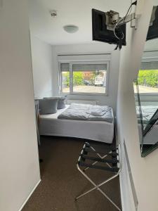Postel nebo postele na pokoji v ubytování Motel Home Berlin