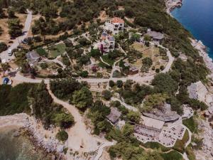 an aerial view of a house on a hill next to the ocean at Porto Valitsa in Paliouri