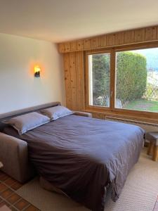 Postel nebo postele na pokoji v ubytování Superbe appartement avec vue et parking gratuit
