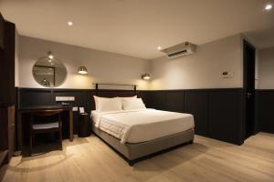 Postel nebo postele na pokoji v ubytování Monocolo Boutique Hotel