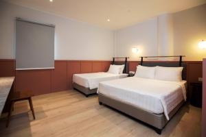 Postel nebo postele na pokoji v ubytování Monocolo Boutique Hotel