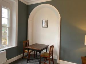 a dining room with a table and chairs at Red Barns Bed & Breakfast in Redcar