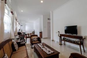 Area tempat duduk di Palem Kipas Homestay