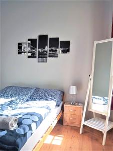 Posteľ alebo postele v izbe v ubytovaní Aurora Apartments