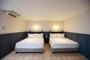 Postel nebo postele na pokoji v ubytování Monocolo Boutique Hotel