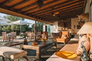 a living room with couches and tables and chairs at Vale Do Manantio in Moura