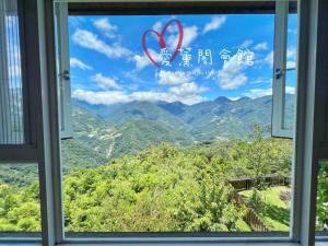 a window with a view of mountains at I-think Resort in Ren'ai