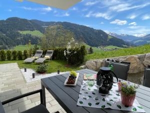 a picnic table with a view of the mountains at Apartment Bergblick - WIL110 by Interhome in Oberau