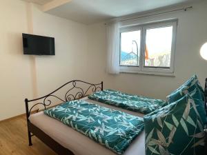 Posteľ alebo postele v izbe v ubytovaní Apartment Bergblick by Interhome