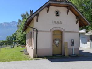 a building with a door with a sign on it at Chalet Zur Säge by Interhome in Albinen