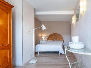 a bedroom with a bed and a glass table at Holiday Home Le Repos by Interhome in Commes +19 photos