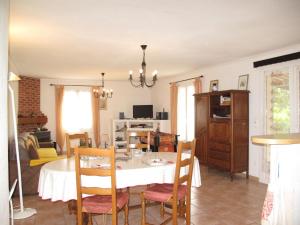 a kitchen and dining room with a table and chairs at Holiday Home Villa Audrey by Interhome in Quinson +19 photos