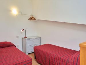 A bed or beds in a room at Holiday Home Gelsomino-1 by Interhome