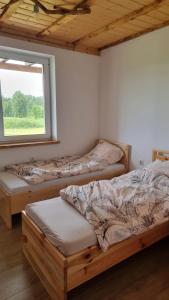 Tempat tidur dalam kamar di Gospodarstwo u Jasia