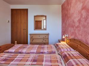 A bed or beds in a room at Holiday Home Antonia by Interhome